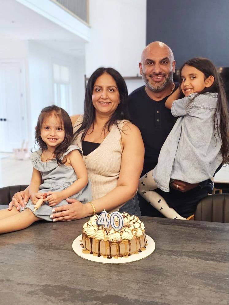 Dave Sidhu with his wife, Ranjna, and their two daughters